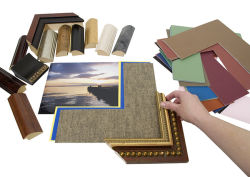 Deciding on a framing project with an assortment of colored matboard and frame samples