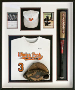 baseball shadowbox with bat, glove, jersey, hat and pictures.