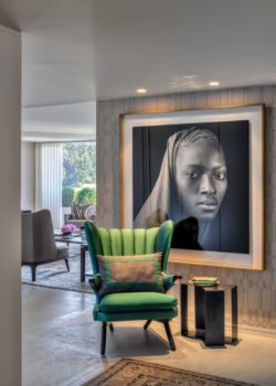 Large custom framed artwork in contemporary room setting.